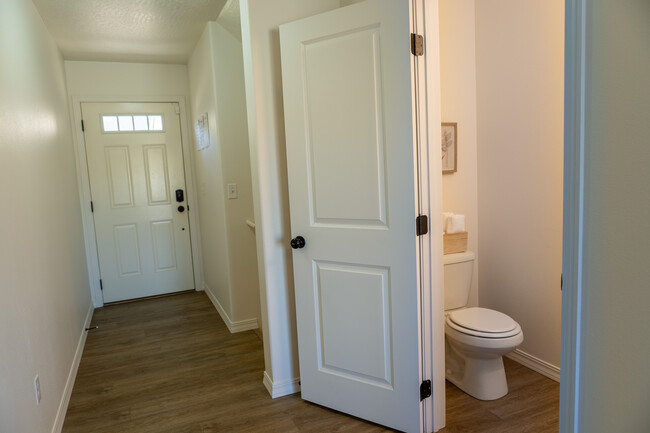 Main Level front door, hall, and 1/2 bathroom - 1280 SW Selway Ln