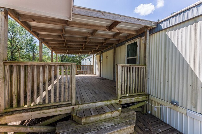 Building Photo - Updated mobile home on acre lot with garag...