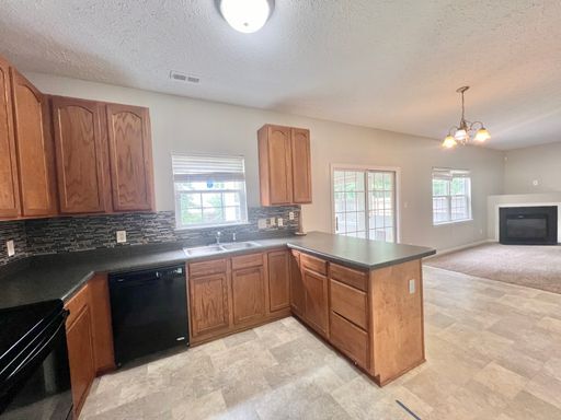 Building Photo - Charming 4BD, 2.5BA Durham Home with a Bonus Sun-Room & Fenced In Yard Only 10 Minutes Away from ...