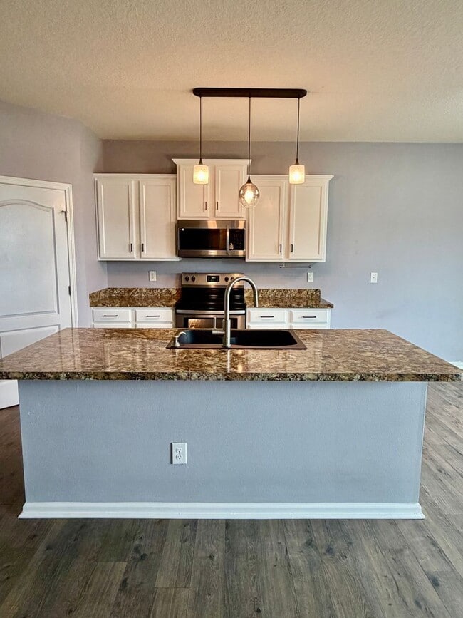 Building Photo - Spacious 5 Bedroom, 3 Bathroom Home with Flex Room, Loft & Pond View