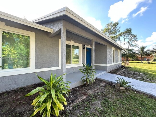 Building Photo - 6452 Royal Palm Beach Blvd
