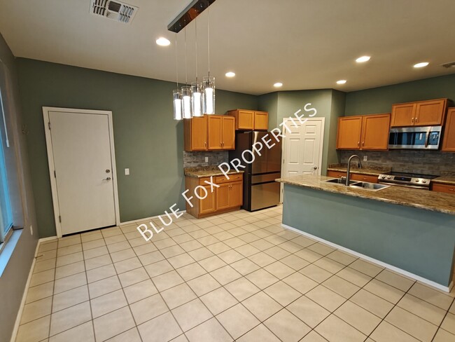 Building Photo - 10947 E Passion Flower Ln
