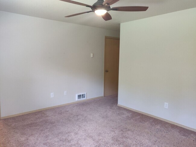 Building Photo - Charming 4-Bedroom Home on 1/2 Acre with a Fenced Backyard, Fully Insulated Double-Car Garage, in...