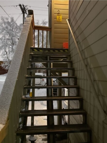 This unit has stairs leading up to the apartment unit - 625 E 22nd Ave