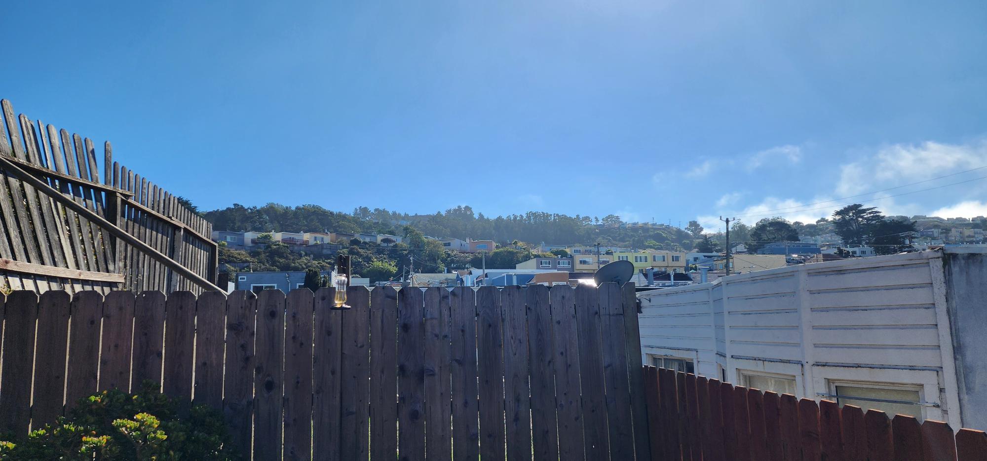 view from the enclosed yard up to the sky and McClaren Ridge - 245 Concord St