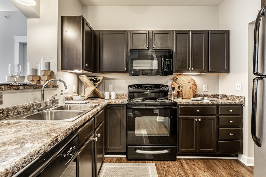 Spacious Kitchen with Under Cabinet Lighting - The Fort Apartments