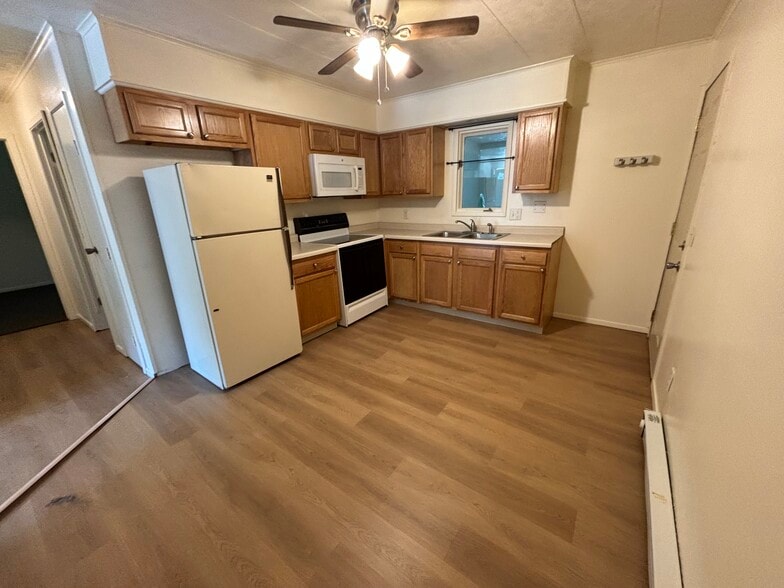 Refrigerator, electric stove, and microwave - 5161 NE 5th St