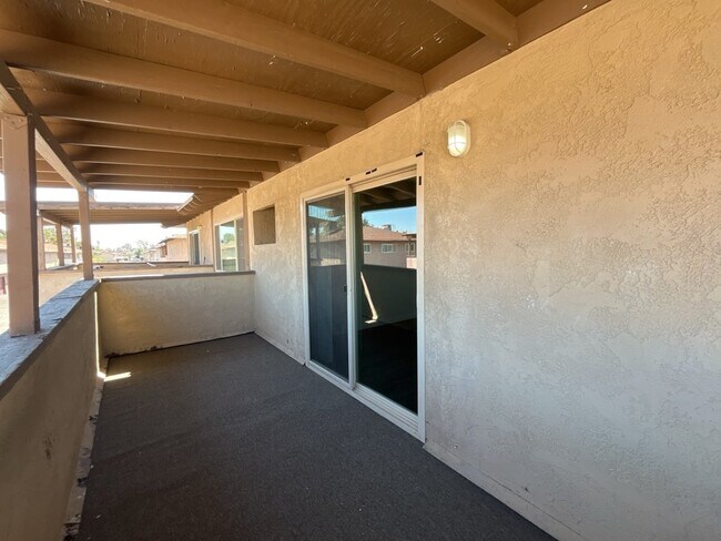 Building Photo - 2 bedroom 2 bathroom second level unit centrally located in the El Sol del Pueblo community.