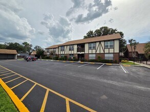 Building Photo - Lakefront First-Floor Condo in Camelot by ...