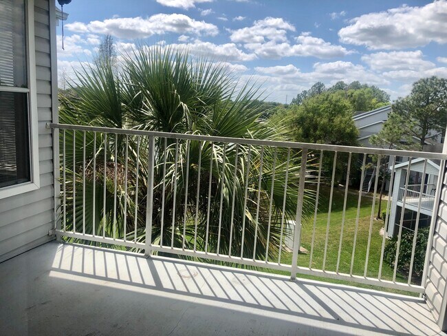 Building Photo - WATER VIEW! 2X2- Spacious 3rd floor condo with tranquil water views from balcony!! Gated Regency ...