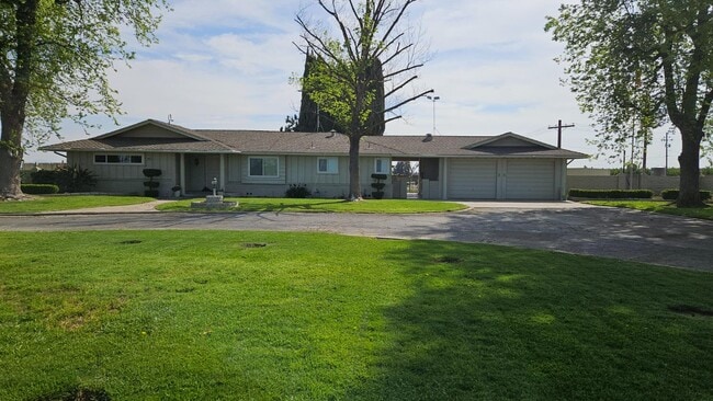 Building Photo - 7686 S Temperance Ave