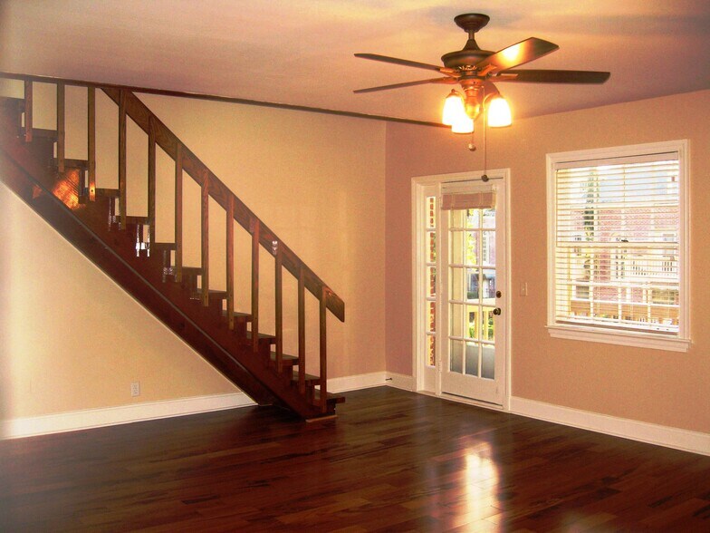 Living room with the door to the patio and stairs to the loft /master bedroom - 849 Lasalle St