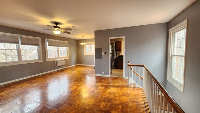 Building Photo - Spacious and Bright End Unit in Park-like Setting