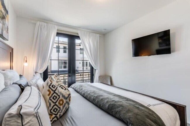 Building Photo - Modern Living Meets Walkable City Charm in...
