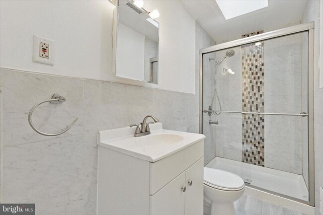 Building Photo - Updated 2BR Townhome with Dual Ensuite Baths, Hardwood Floors & Private Patio in Grays Ferry