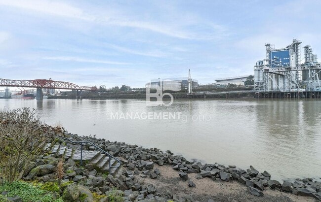 Building Photo - Spacious Riverfront Condo- Beautiful Condo w/River View from Bedroom! Parking Included!
