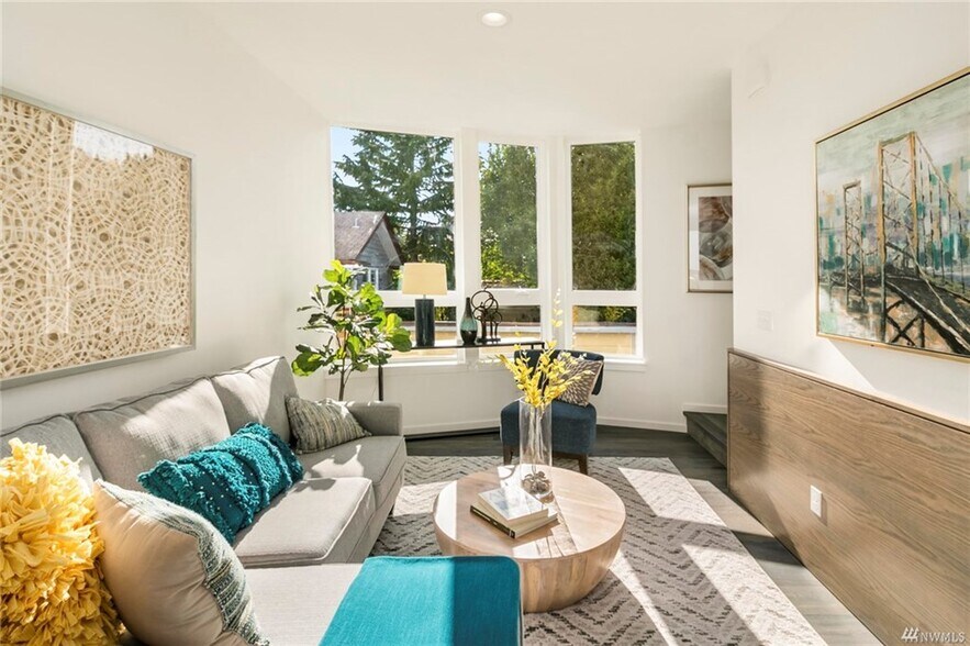 Bright living room open to kitchen and dining. - 818 N 47th St