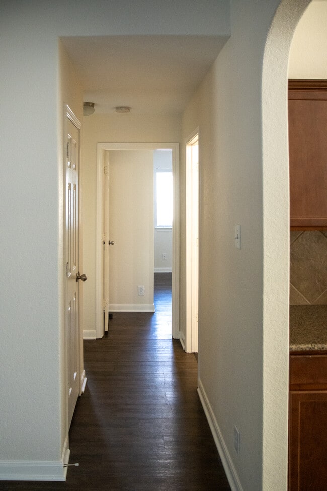 Hallway to two bedrooms, bathroom, laundry, and hall closet - 2808 Granite Cove