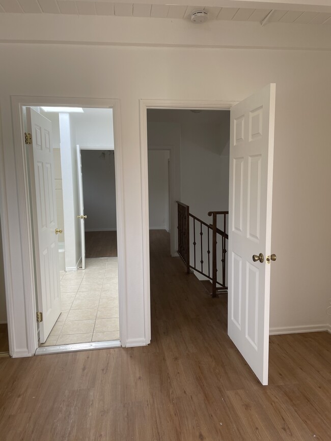 Hallway and bathroom in between the upstairs bedrooms - 5358 Baza Ave