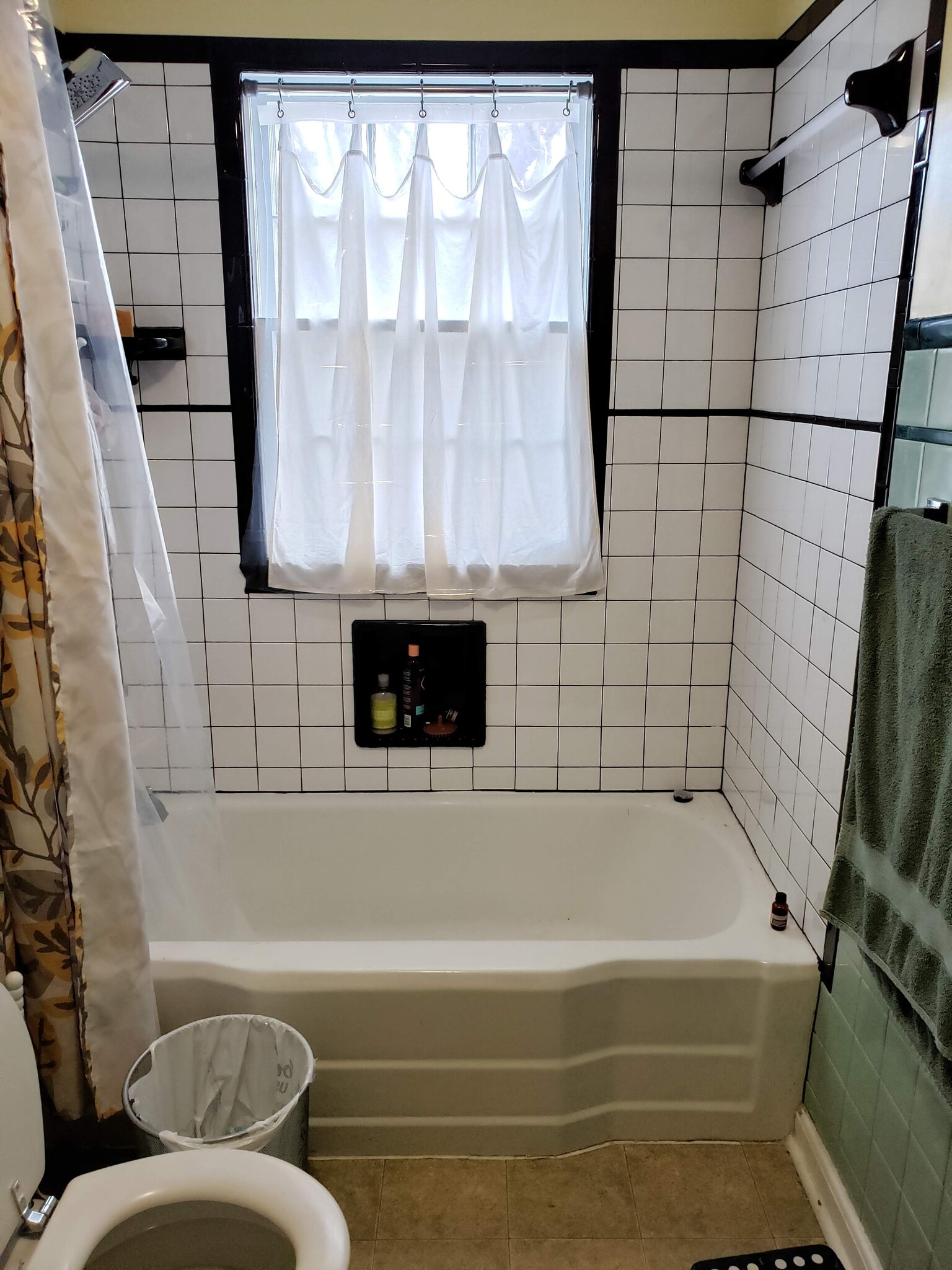 Newly tiled bath and shower with exterior window opened back up - 1329 47th St