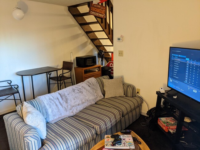 Living room and stair to loft - 1406 University City Blvd
