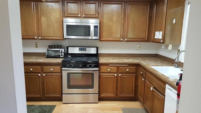 Building Photo - Available Now is a Condo style Townhouse i...
