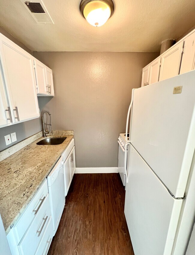 Explore the functionality of this compact modern kitchen, designed for convenience. - Williams Street