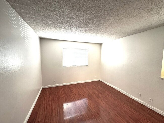 Building Photo - 2 Bedroom, 2 Bath Upstairs Condo with Private Balcony & 2-Car Garage, Gated Community, Water/Tras...
