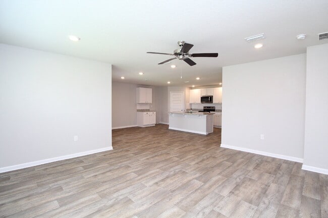 Building Photo - Coming Available Soon – 4BR/2BA Brick Home with Open Floor Plan, Solar Panels & 2-Car Garage in L...