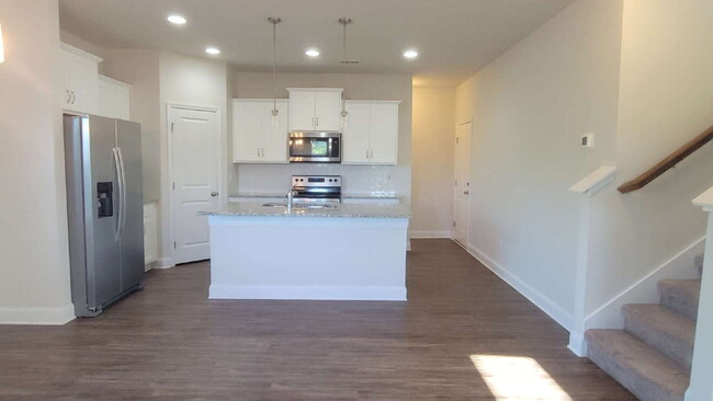 Building Photo - "Spacious 4-Bedroom Retreat with Modern Gr...