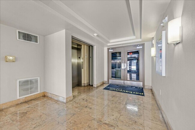Building Photo - Top level 2 bedroom condo located in guard...