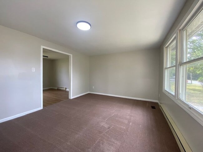 Building Photo - Welcome to this charming three bedroom, on...