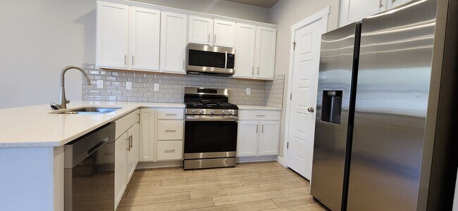 Building Photo - $2,000 OFF 4-bed, 3.5-bath Townhome Available Now!