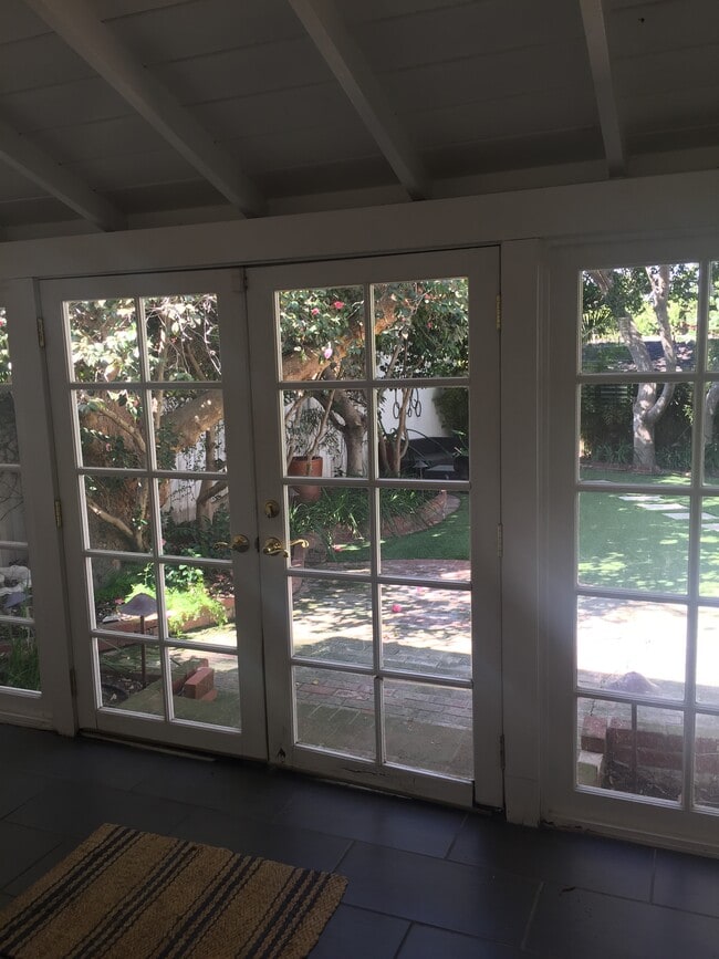 View of private backyard, extra storage behind the garage. - 3037 Motor Ave