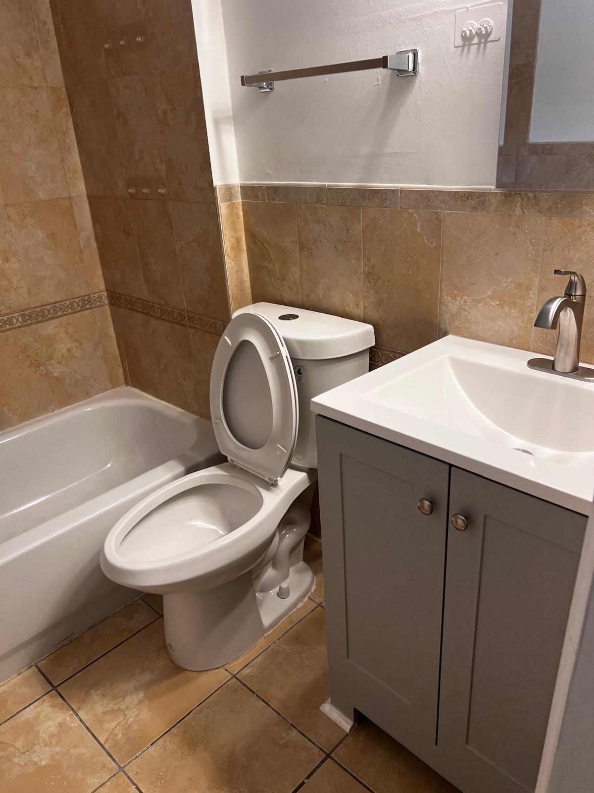 Floor to Ceiling Ceramic Tile Bathroom - 2448 Lakeview Ave