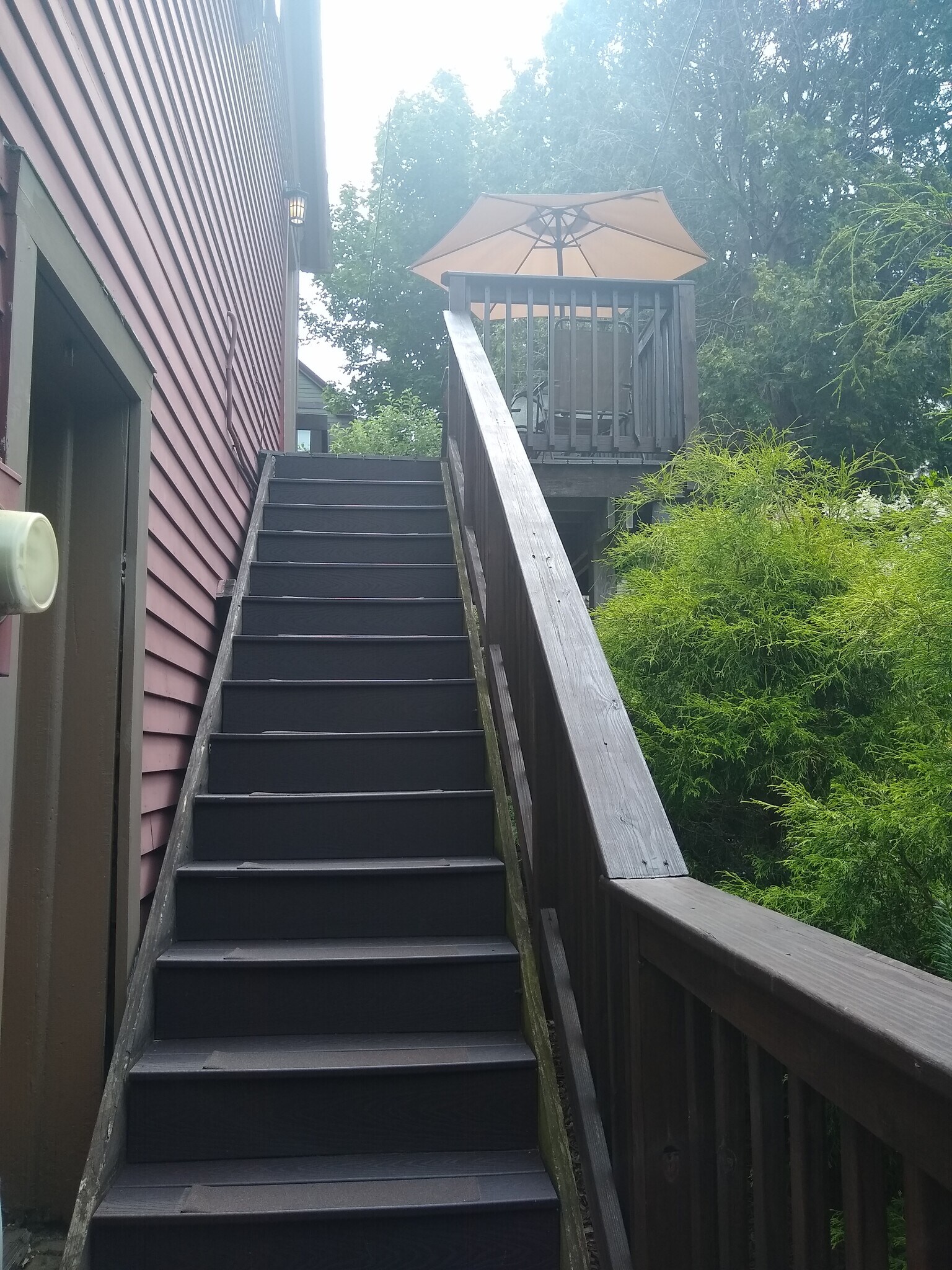 Stairs up to apartment; another set of shorter stairs on the back side of the deck - 156 Henry St