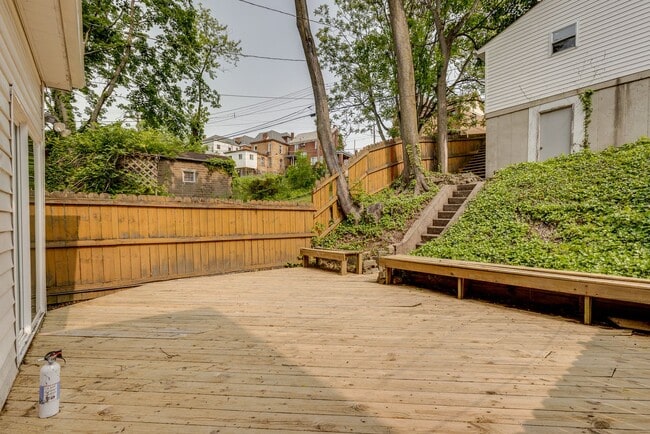 Building Photo - AVAILABLE June 2026 - Beautiful 4 Bedroom, 2 Bath Home w/ Front Porch Swing!