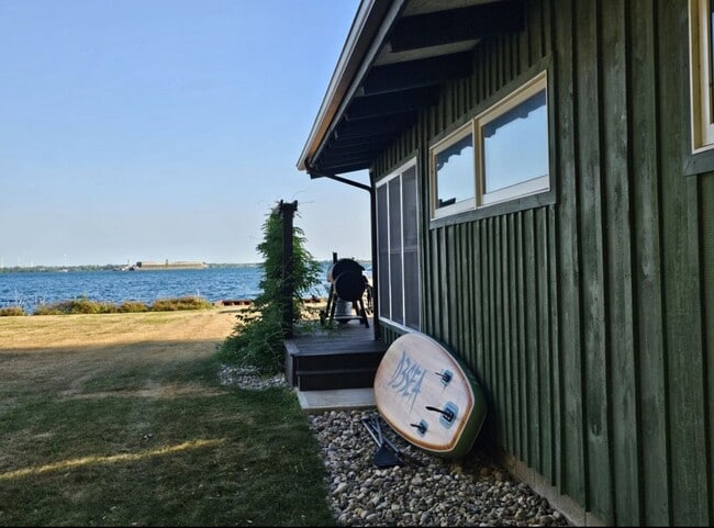 Building Photo - Offered for Rent – Available April 1, 2026 St. Lawrence Seaway Luxury Waterfront Home – Cape Vinc...