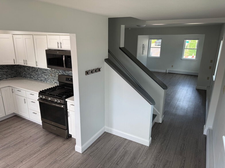 View of first floor from kitchen to main living area - 251 Main St