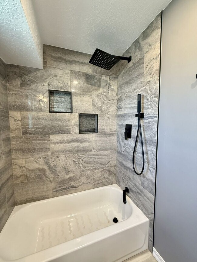 Building Photo - Spacious Comfort Meets Practical Living in...