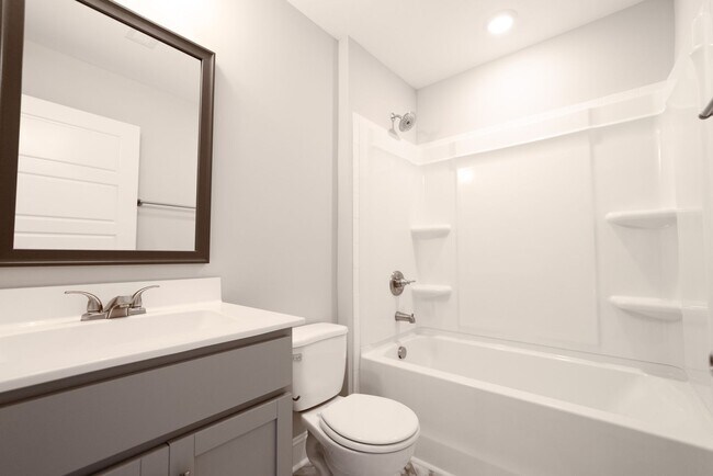 Building Photo - Elegant Home with Stone Fireplace, Kitchen Island and Designer Primary Suite