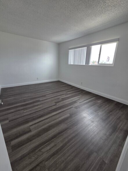 Bedroom with Luxury Vinyl Plank - 3455 Elm Ave