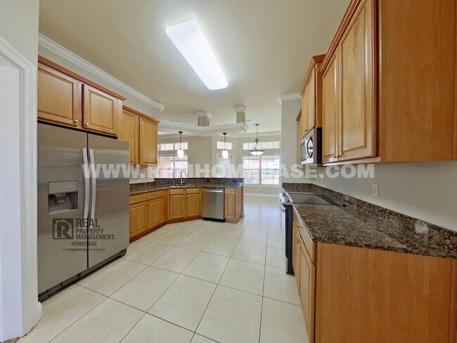 Building Photo - ELEGANT 4/3 + OFFICE IN GATED CHANAN ESTATES | Gas Fireplace + Formal Dining!