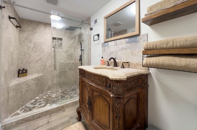 Building Photo - Discover the charm of this FULLY FURNISHED basement unit, tucked away in a beautifully updated bu...