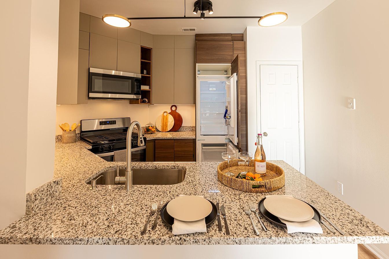 Stainless steel appliances with built-in fridge - 14301 Rosy Ln