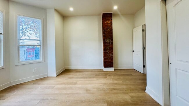 Bedroom Exposed Brick - 5459 Cedar Ave