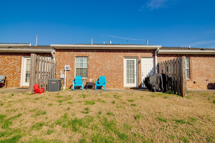 Private patio with storage room off the back of the unit. - 1040 Charlie Daniels Pkwy