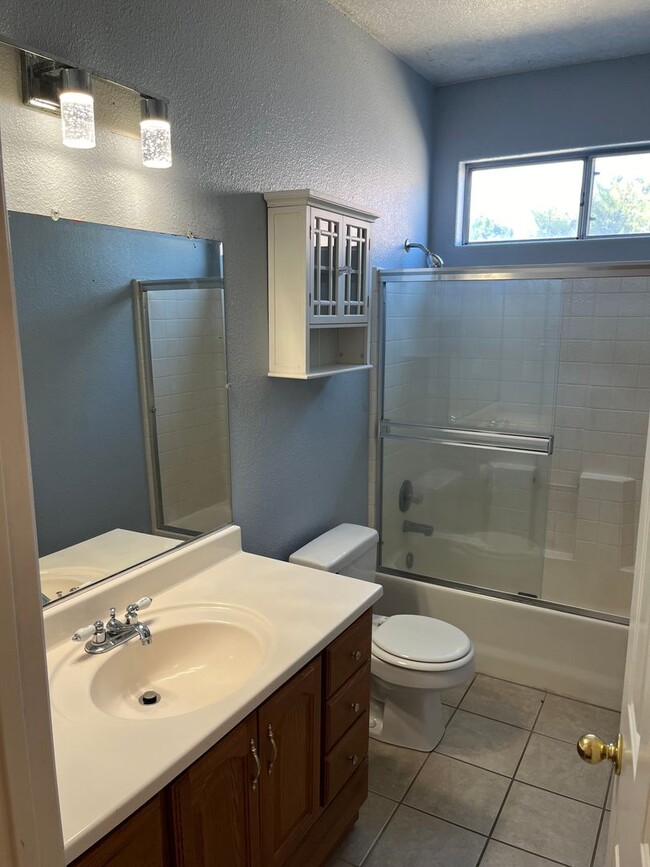 Building Photo - 4 Bedroom, 2 Bathroom Home with a Pool in ...