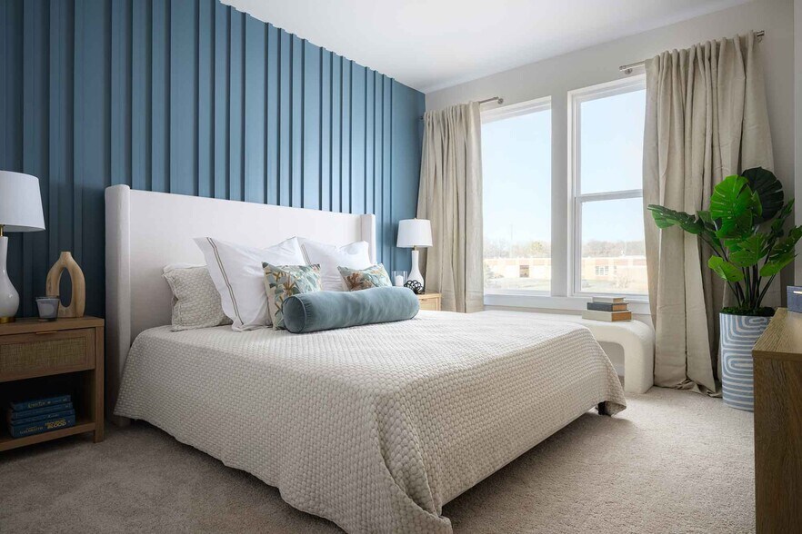 The spacious primary suite features two large fitted closets and a spa-like en-suite bathroom. - 1421 Lithium Ln