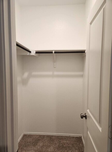 Spacious walk-in closet in main bedroom. - 13306 Mussel Run
